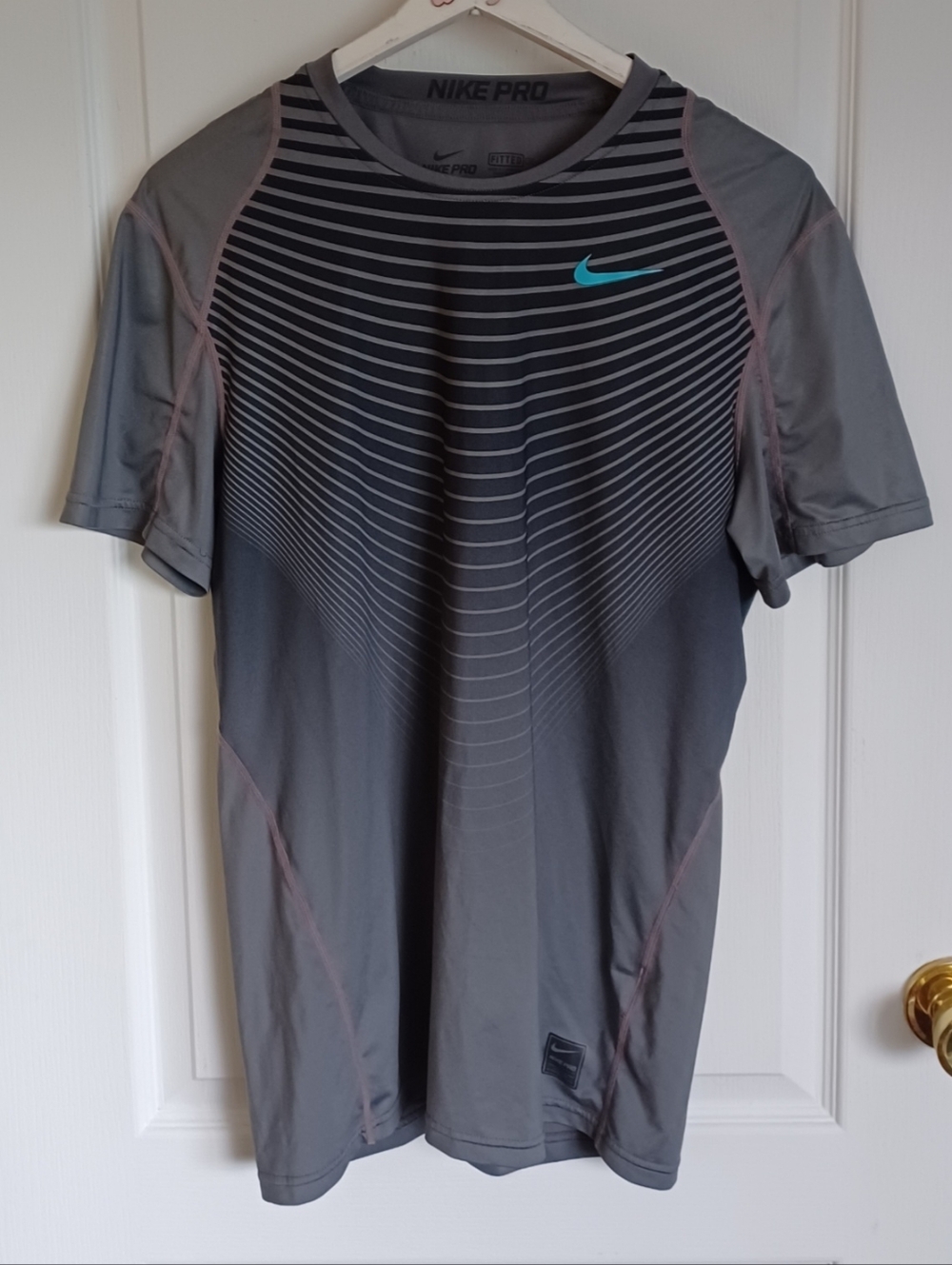 NIKE PRO DRI-FIT MEDIUM FITTED STYLE#744065 BLACK/GRAY STRIPED WITH AQUA SWOOSH